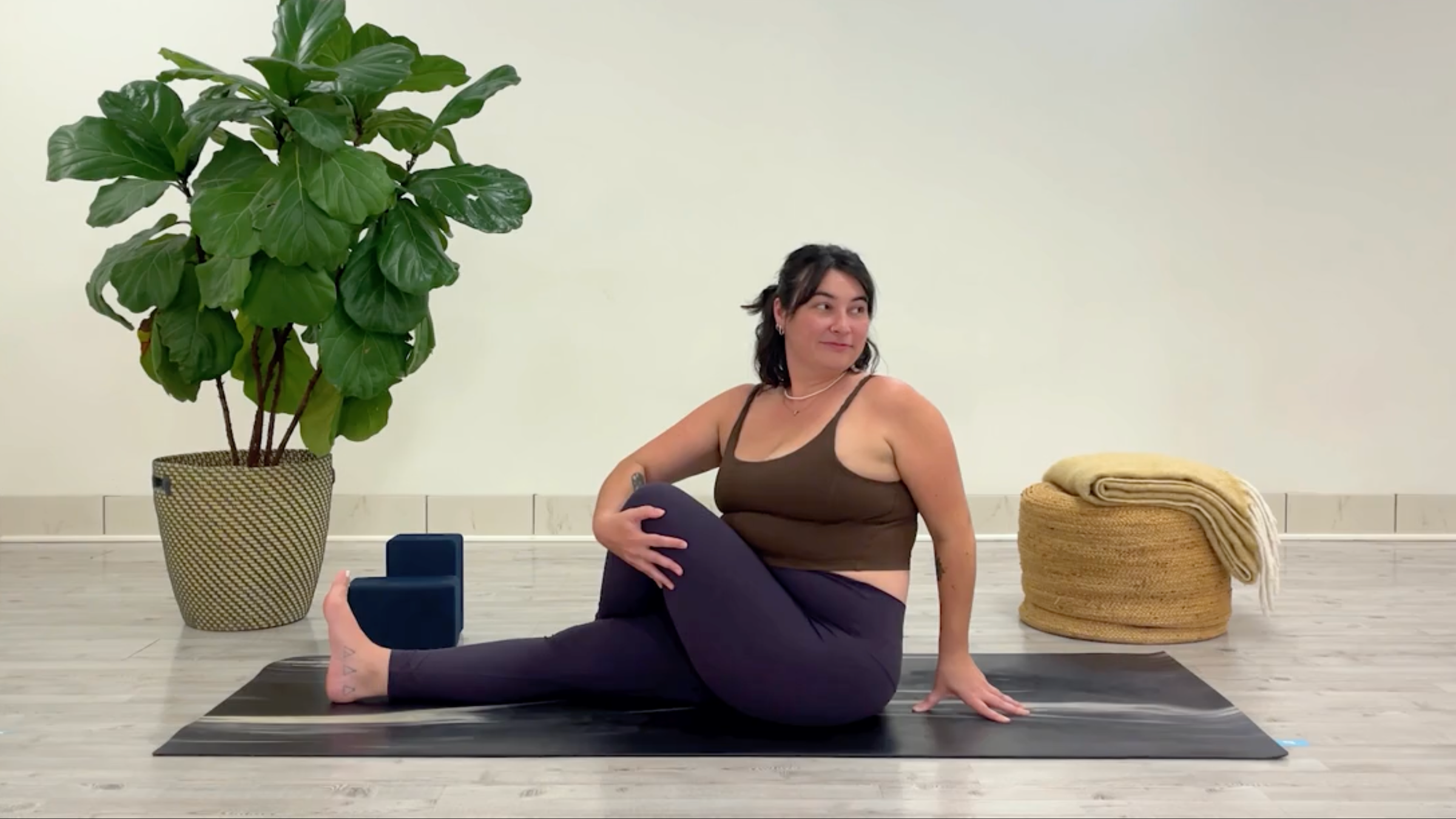 Teacher Taylor Lorenz in Seated Side Stretch